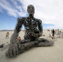 Burning Man sculpture of man in lotus position