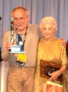 Peter Beagle holding his Hugo Award